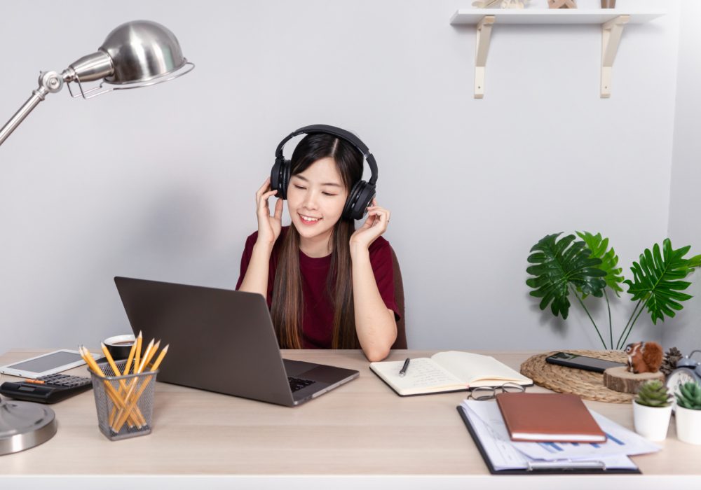 38271746-pensive-asian-woman-is-relaxing-on-desktop-working
